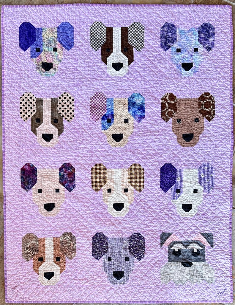 Purple paper pieced puppy, dog, hand quilted baby quilt.